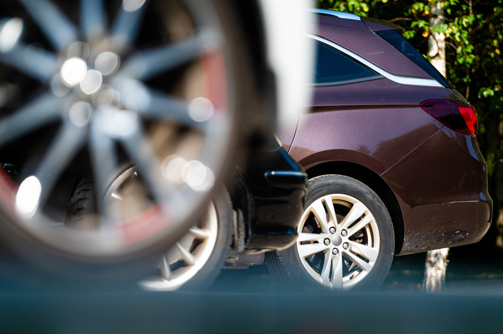 closeup-of-the-wheels-and-bumpers-of-a-car-parked-2023-11-27-05-21-02-utc.jpg